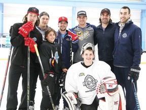 Eleven-year-old Carter Severin of Fort McMurray was treated to some pick up hockey with local NHL player at RHP Training Centre in Sudbury, Ont. on Tuesday May 24, 2016. From left are Tyler Bertuzzi, Severin, Andrew Desjardins, Ryan Johnston, Marcus Foligno, Zack Stortini, Mackenzie Savard and Alain Goulet. Gino Donato/Sudbury Star/Postmedia Network