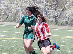 Amelia Masterson-Pinedo of the Conferderation Chargers battles for the ball with Ariane Saumure of Macdonald Cartier during senior girls high school soccer semi-final action   in Sudbury, Ont. on Tuesday May 24, 2016. Gino Donato/Sudbury Star/Postmedia Network