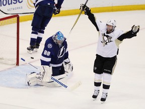Pittsburgh Penguins center Matt Cullen celebrates a goal by teammate Sidney Crosby. (AP Photo/Brian Blanco)