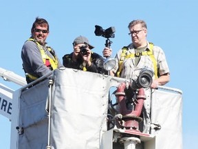 Seaforth firefighter Don Brown runs the Seaforth fire department’s bucket truck as photographer Rick Borg and producer Chris Cooper take pictures of Seaforth’s downtown when Rediscovering Canada came to town in 2013.(File photo)