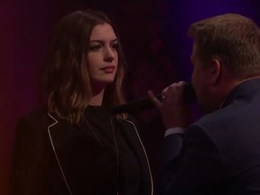 Anne Hathaway gets ready to rap with James Corden. (YouTube)