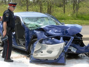 London Police investigate a car that collided with a LTC bus on Wonderland at Exeter Road on Wednesday May 25, 2016. 
MORRIS LAMONT  / THE LONDON FREE PRESS / POSTMEDIA NETWORK