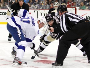 Steven Stamkos of the Tampa Bay Lightning and Sidney Crosby of the Pittsburgh Penguins take a face-off at Consol Energy Center in Pittsburgh on March 4, 2013. (Justin K. Aller/Getty Images/AFP)
