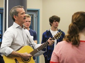 Retired Canadian astronaut Chris Hadfield performs his song "Feet Up" in front of students from the Lambton Kent District School Board Wednesday. Students recorded his song during an audio recording workshop at the inaugural specialist high skills majors conference held at Lambton College.  (Barbara Simpson/Sarnia Observer/Postmedia Network)