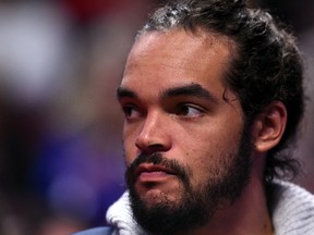 Chicago Bulls center Joakim Noah sits on the bench during the first quarter against the Philadelphia 76ers at the United Center. (Mike DiNovo-USA TODAY Sports)