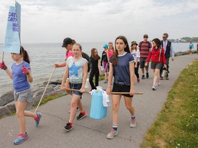 Students in teacher Mark Kyte’s Grade 6/7 class from Cathedral Catholic School walk along the waterfront at Breakwater Park as part of their six-kilometres Water Walk on Wednesday. The students are trying to raise awareness and funds towards providing clean water to communities in Tanzania through the work of World Vision. (Julia McKay/The Whig-Standard)