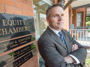 Lawyer Paul Champ, seen here outside his law firm known as Equity Chambers, is leading a new class action lawsuit that, if successful, could potentially cost the Ontario government tens of millions of dollars in damages.(Wayne Cuddington/Postmedia)