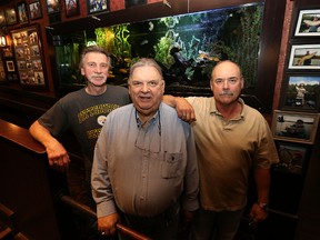 Retired Winnipeg vice cops John Kozachuk, Bob Paquin and Jack Tinsley (from left) gather for a photograph at the Nor Villa Hotel on Henderson Highway on Wed., May 25, 2016. The three are part of a committee which has organized a 40-year reunion of vice cops on Aug. 16. Kevin King/Winnipeg Sun/Postmedia Network