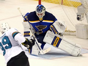 St. Louis Blues goalie Jake Allen makes a save on San Jose Sharks centre Logan Couture during Game 5 of the Western Conference final at Scottrade Center. (Aaron Doster/USA TODAY Sports)