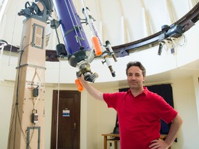 Jan Cami, an associate professor of physics and astronomy and the director of the Cronyn observatory, shows Western University?s 75-year-old telescope. Mars is coming closer to Earth than it has for over 10 years, and the observatory is having a viewing on Saturday nights through till Aug. 27. (MIKE HENSEN, The London Free Press)