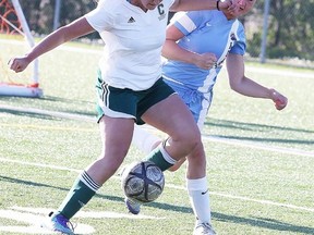 Miranda Zilkowsky of Confederation Secondary School battles for the ball with Kaija Punkinnen of the St. Benedict Bears  during senior girls premier division city final soccer action in Sudbury, Ont. on Wednesday May 25, 2016. Gino Donato/Sudbury Star/Postmedia Network