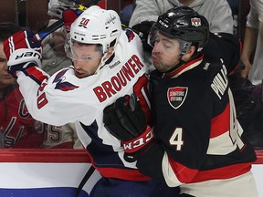 Ottawa Senators defenceman Chris Phillips slams Troy Brouwer from the Washington Capitals into the boards during NHL action at the Canadian Tire Centre in Ottawa Thursday Feb 5, 2015. (Tony Caldwell/Ottawa Sun/Postmedia Network)