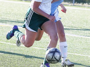 Miranda Zilkowsky of Confederation Secondary School battles for the ball with Kaija Punkinnen of the St. Benedict Bears  during senior girls premier division city final soccer action in Sudbury, Ont. on Wednesday May 25, 2016. Gino Donato/Sudbury Star/Postmedia Network