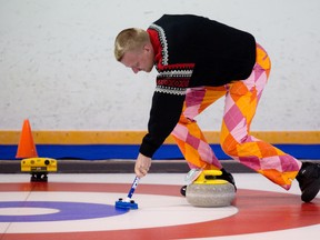 Norwegian curler Havard Vad Petersson sweeps a rock past testing equipment during the World Curling Federation’s Sweeping Summit at the North Grenville Curling Club in Kemptville.