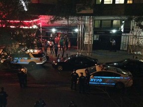 Authorities stand outside Irving Plaza, near Manhattan's Union Square in New York after a shooting Wednesday, May 25, 2016. Police say several were injured in a deadly shooting inside the concert venue, where hip-hop artist T.I. was scheduled to perform. (AP Photo/Dana Schimmel)