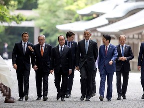 From left, Italian Premier Matteo Renzi, European Commission President Jean-Claude Juncker, French President Francois Hollande, Prime Minister Justin Trudeau, German Chancellor Angela Merkel U.S. President Barack Obama, Japanese Prime Minister Shinzo Abe, European Council President Donald Tusk, and British Prime Minister David Cameron, walk past the Kaguraden as they visit Ise Jingu shrine in Ise, Mie Prefecture, Japan, Thursday, May 26, 2016, as part of the G-7 Summit. REUTERS/Carolyn Kaster/Pool