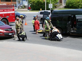 Greater Sudbury Police said several people were taken to hospital as a precaution following a two-vehicle collision at  Paris and Larch Streets in Sudbury, Ont. on Wednesday May 25, 2016. A large van carrying people with disabilities was involved in the crash. John Lappa/Sudbury Star/Postmedia Network
