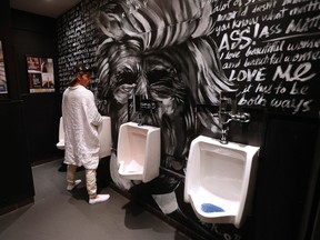 Winnipeg artist Nereo Eugenio stands by his Donald Trump piece that he created in the washroom at the District Stop nightclub in Winnipeg, Wednesday, May 25, 2016.