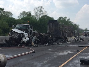 The driver of a transport truck that collided with another vehicle on Hwy 402 near Strathroy Thursday was pulled from his burning vehicle. Morris Lamont/The London Free Press