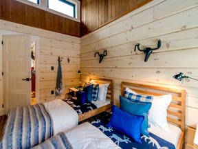 The bedroom features two wall-mounted stag head installations that, 
if you look closer, are actually made of bicycle seats and handlebars.
