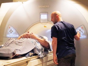 A technologist prepares the MRI machine at Belleville General Hospital to scan a patient in Belleville, Ont.