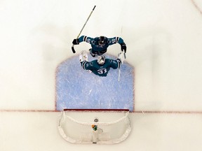 The San Jose Sharks' Chris Tierney and Martin Jones celebrate after a 5-2 win over the St. Louis Blues during Game 6 of the Western Conference final in San Jose on May 25, 2016. (AP Photo/Marcio Jose Sanchez)