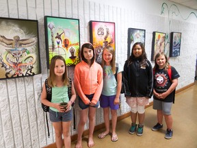Vermilion Elementary School students stand in front of some of the art pieces of the Dreaming with my 'Great Mother' exhibit. Taylor Hermiston/Vermilion Standard/Postmedia Network.