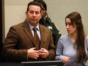Casey Anthony (R) stands with her attorney Jose Baez during her sentencing hearing at the Orange County Courthouse July 7, 2011 in Orlando, Florida. After a private investigator who worked on the case says Anthony paid Baez with sexual favours, Baez has denied the allegations and threatened to sue. (Photo by Joe Burbank-Pool/Getty Images)
