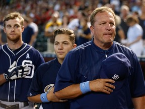 Interim Manager Pat Murphy of the San Diego Padres stands attended with his son, Kai, for the national anthem on father's day at the MLB game against the Arizona Diamondbacks, Arizona.  (Christian Petersen/Getty Images/AFP)