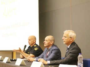 OPP Amber Alert co-ordinator Sgt. Pierre Gautier, left, speaks during a panel discussion on the Amber Alert system at OPP headquarters in Orillia on Thursday. (POSTMEDIA NETWORK)