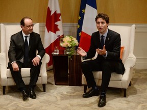 Prime Minister Justin Trudeau, right, and French President Francois Hollande take part in a bilateral meeting in Shima, Japan during the G7 Summit on Thursday, May 26, 2016. THE CANADIAN PRESS/Sean Kilpatrick
