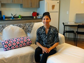 Suzie Bad Eagle, 29, looks sits on the couch at her new home at Edwardson Place, a home in downtown Edmonton that offers supportive housing for women struggling with addictions and homelessness. Photo by Larry Wong/Postmedia Network