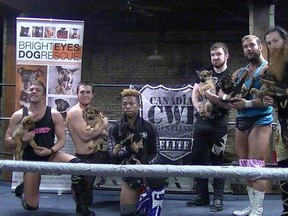 Hotshot Danny Duggan (second from right) and the CWE stars helped promote a dog rescue group before a show in Regina on Tuesday. They hit the ring in Winnipeg at Holy Cross Gymnasium on Friday.
