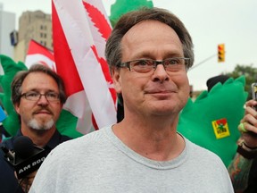 Marijuana advocate Marc Emery walks down a street followed by his supporters following his release from an American prison for selling marijuana seeds in the U.S., in Windsor, Ontario August 12, 2014. REUTERS/Rebecca Cook