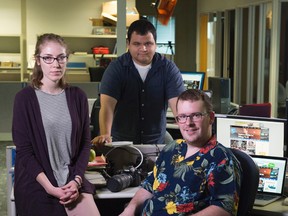 Fort McMurray Today staff members from left, Olivia Condon, Vincent McDermott and Robert Murray in the offices of the Edmonton Journal and the Edmonton Sun where they have been working since they were evacuated from Fort McMurray. Shaughn Butts/POSTMEDIA  NETWORK