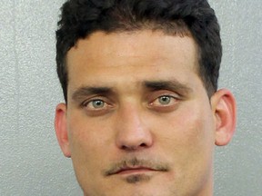 In this photo made available by the Broward County's Sheriff's Office shows Sigfredo Garcia under arrest on Wednesday, May 25, 2016. Garcia, 34, was arrested on a cocaine possession. He is also a suspect in the killing of a well-known Florida State University professor. Daniel Markel was shot in the head inside his garage in Tallahasse, Fla., in July 2014. (Broward County Sheriff's Office via AP)