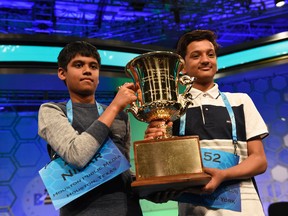 Nihar Janga, 11, of Austin, Texas (L) and Jairam Hathwar, 13, of Painted Post, N.Y. (R) celebrate as co-champions during the 2016 Scripps National Spelling Bee at the Gaylord National Resort and Convention Center, May 26, 2016. (Jack Gruber-USA TODAY NETWORK)