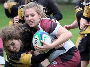 Ava Chauvin, right, and the Wallaceburg Tartans are going to the OFSAA 'A/AA' girls rugby championship in Ottawa. (MARK MALONE/The Daily News)
