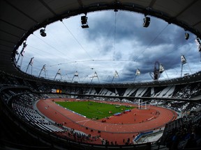 This Saturday, May 5, 2012 file photo shows the Olympic Stadium in the Olympic Park in London. The IOC says 23 athletes have tested positive in reanalysis of their doping samples from the 2012 London Olympics. The International Olympic Committee announced the results Friday, May 27, 2016 after retesting 265 London samples with improved techniques. The IOC says the athletes represent five sports and six countries. It did not name them. (AP Photo/Matt Dunham, file)