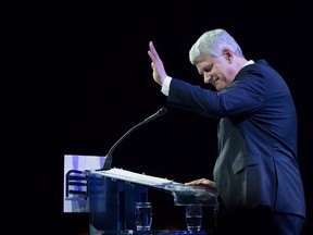 Former prime minister Stephen Harper pauses for a moment as he addresses the Conservative Party of Canada convention in Vancouver, Thursday, May 26, 2016. THE CANADIAN PRESS/Jonathan Hayward