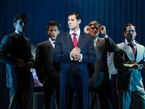 This image released by Jeffrey Richards Associates shows Benjamin Walker, center, and the cast during a performance of "American Psycho," opening at the Gerald Schoenfeld Theatre in New York. Producers of the adaptation of the once-controversial novel by Bret Easton Ellis said Thursday will close June 5 after 81 performances. (Jeremy Daniel/Jeffrey Richards Associates via AP)