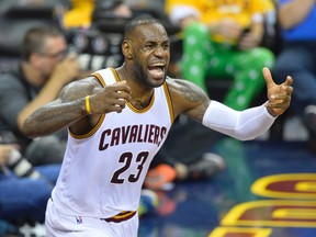 Cleveland Cavaliers forward LeBron James (23) reacts in the third quarter against the Toronto Raptors in game five of the Eastern conference finals of the NBA Playoffs at Quicken Loans Arena May 25, 2016. (David Richard-USA TODAY Sports)