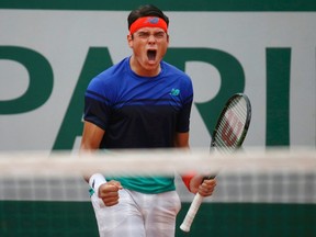 Milos Raonic of Canada roars during a match against Andrej Martin of Slovakia at Roland Garros in Paris, France on May 27, 2016. (REUTERS/Pascal Rossignol0