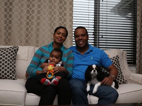 Heather and Johann Delgado with their son Zachary and dog Zoe in their Trenton B home by Sterling Homes.