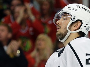 In this May 18, 2014, file photo, Los Angeles Kings' Slava Voynov reacts after Chicago Blackhawks' Duncan Keith scored during the second period in Game 1 of the Western Conference finals in Chicago. (AP Photo/Nam Y. Huh, File)
