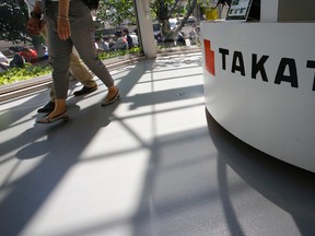 In this May 4, 2016 file photo, visitors walk by a Takata Corp. desk at an automaker's showroom in Tokyo.  Eight automakers are recalling more than 12 million vehicles in the U.S. to replace Takata air bag inflators that can explode with too much force.
Documents detailing recalls by Honda, Fiat Chrysler, Toyota, Mazda, Nissan, Subaru, Ferrari and Mitsubishi were posted Friday, May 27 by the government. (AP Photo/Shizuo Kambayashi, File)