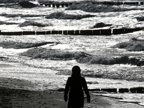 A woman takes a stroll at the Baltic Sea coast of  Wustrow, eastern Germany, Tuesday Feb. 23, 2016. W ( Bernd Wuestneck/dpa via AP)