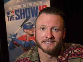 Blue Jays' Josh Donaldson promotes "MLB The Show 16" at the Real Sports, in Toronto. (Stan Behal/Postmedia Network)