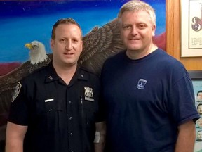 Halifax Regional Police Superintendent Robin McNeill (left) and New York Transit District 4 Police Officer Michael Fruchter pose in New York in this undated handout photo. McNeill was on holiday in NYC when he helped grabbed a subway fare beater. DCPI/Handout/Postmedia Network