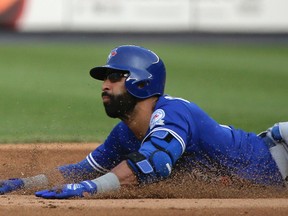 Toronto Blue Jays' Jose Bautista stretches a single into a double as he slides safely into second base during the eighth inning against the New York Yankees in New York on May 26, 2016. (AP Photo/Julie Jacobson)